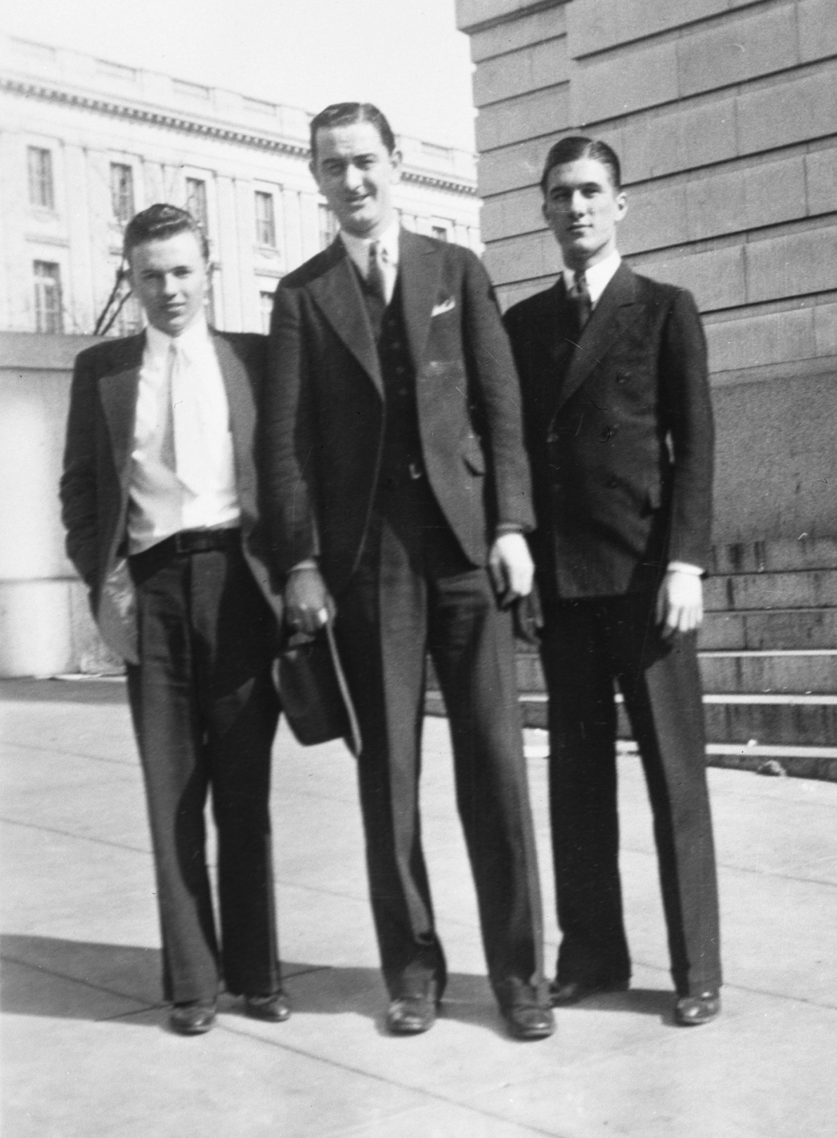 Young Lyndon Johnson, center, with Gene Lattimer and L. E. Jones outside a congressional office building, circa 1933–1935.